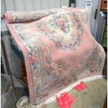 Carpet / rug : a Chinese pink ground rug having green, red , white and sage green colours,