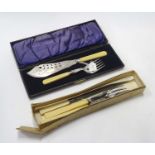 A 3 piece carving sets boxed together with a pair of silver plated fish servers - cased