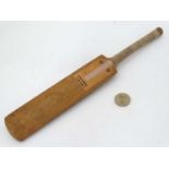 A novelty small cricket bat probably by Grey Nicholls? 11 1/2" long CONDITION: