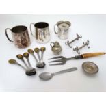 Assorted silver plated wares to include cups knife rests bread fork,