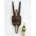 Tribal : An Ethnographic Native Tribal Nigerian horned mask. Approx. 30" high.