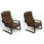 Vintage Retro : a pair of Danish Leather Cantilever chairs with open arms and button back seat and