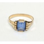 A Continental yellow metal ring with blue stone in an Art Deco setting.