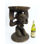 Tribal : An Ethnographic Native Tribal Luba stool, the caryatid support with raised hands. Approx.