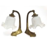 Early 20 thC organic table lamps : a pair of brass and original flower head shaped glass tiltable