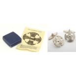 A pair of hallmarked silver cufflinks with Canterbury Cross decoration CONDITION: