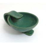 Scandinavian Studio Pottery: A Danish modernist green bowl with handle, 'Danmark' impressed to base,