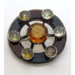 A Scottish white metal brooch of circular form with various agates, cairngorm stone etc.