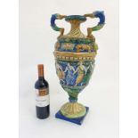 A large 20thC Majolica urn in the style of Cantagalli,