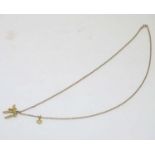 A 9ct gold pendant and chain ( the chain 20" long) together with a small Star of David 14ct gold