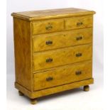 A Victorian pine Chest of Drawers comprising two short over three long drawers,