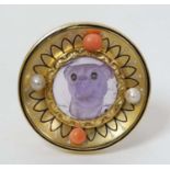 An unusual Continental Gold and gilt metal brooch of circular form set with carved amethyst dog