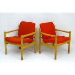 Vintage Retro : a pair of Danish blonde oak open arm chairs with light red woollen upholstery ,