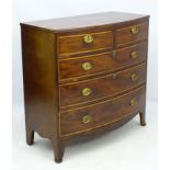 A 19thC mahogany bow fronted chest of drawers comprising two short over three long graduated