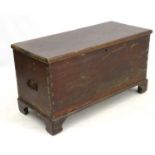 A 19thC teak blanket box opening to reveal storage space within and standing on bracket feet,