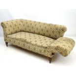 A 19thC Chesterfield sofa with a drop-down end and floral upholstery.