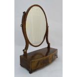 An 18thC mahogany toilet mirror with shaped uprights,