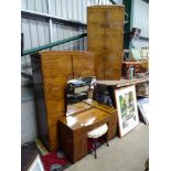 A walnut bedroom suite, comprising a large and small wardrobes, dressing table and stool.