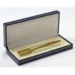 A rolled gold pencil together with a matching pen,