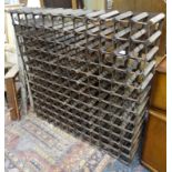 Wine rack : A 156 bottle wine rack of wood and metal construction.