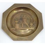 A Bronze foundry dish with relief image of Blacksmith and ' Super Materiam Ignis Triumphans