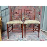 A pair of Arts and Crafts upholstered boudoir chairs