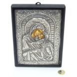 A religious icon with white metal surround CONDITION: Please Note - we do not make