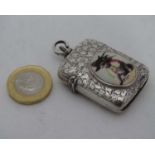 A silver vesta case with later enamel cat decoration CONDITION: Please Note - we