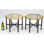 A pair of mid / late 20thC occasional tables with gilt top and ebonised base,
