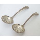 A pair of silver strainer spoons, hallmarked Birmingham 1978 maker KG.