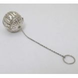 An American Sterling silver tea infuser of melon form .