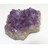 An Amethyst geode, 4 ½" x 6" x 2" high, weight approx 0.