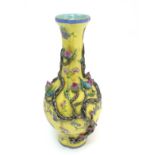 A Chinese Famille Jaune four lobed vase, decorated with various flowers,