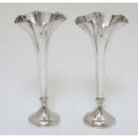 A pair of silver bud vases with fluted rims Hallmarked Sheffield 1907 maker James Dixon & Sons ltd.