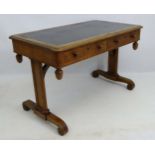 A mid 19thC oak library table with two short drawers and inset leather top,