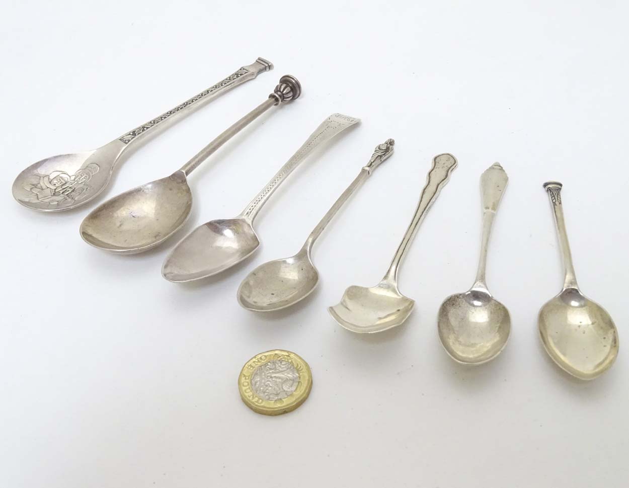 Assorted spoons to include a seal top spoon hallmarked Sheffield 1911 maker Harrods Stores Ltd,