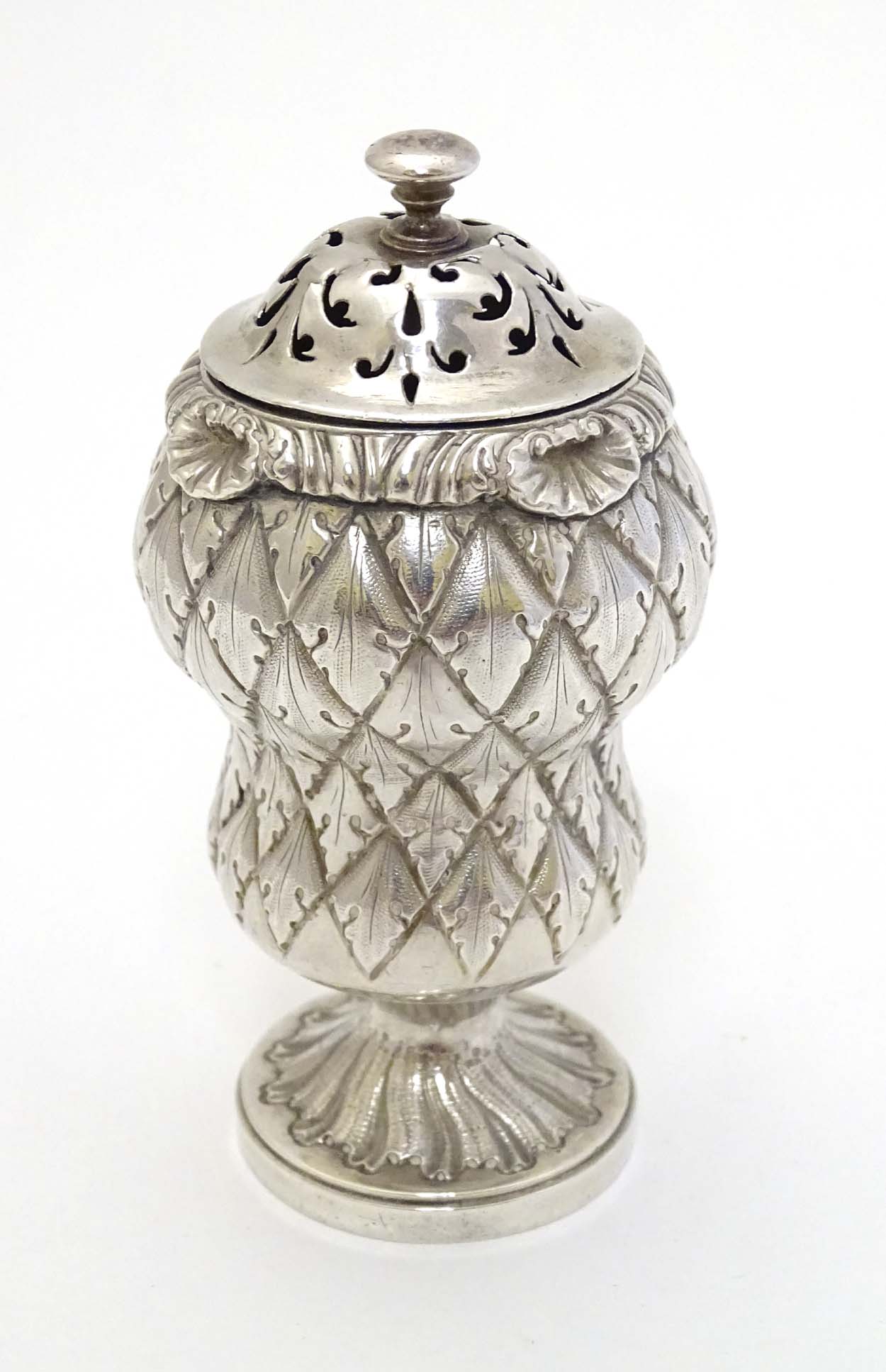 A Geo IV silver pounce pot of stylised thistle form.