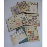 Stamps: A collection of postage stamps in four albums: Mercury stamp album, Victory stamp album x2,