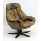 Vintage Retro : a Danish swivel leather bucket chair as designed by H W Klein for Bramin ,