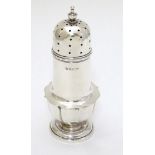 A silver sugar caster hallmarked Birmingham 1916 maker A & J Zimmerman Ltd.