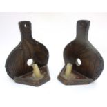 A pair of c.1900 oak wall mounted candle sconces in the form of bellows.