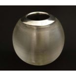 A glass bar top/ table top match striker of spherical glass form with ribbed sides and silver rim