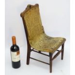 A c. 1900 bentwood child's chair, with pierced decoration and brass studs.