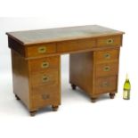 A mid / late 19thC mahogany pedestal Campaign Desk with original brass handles and brass catches