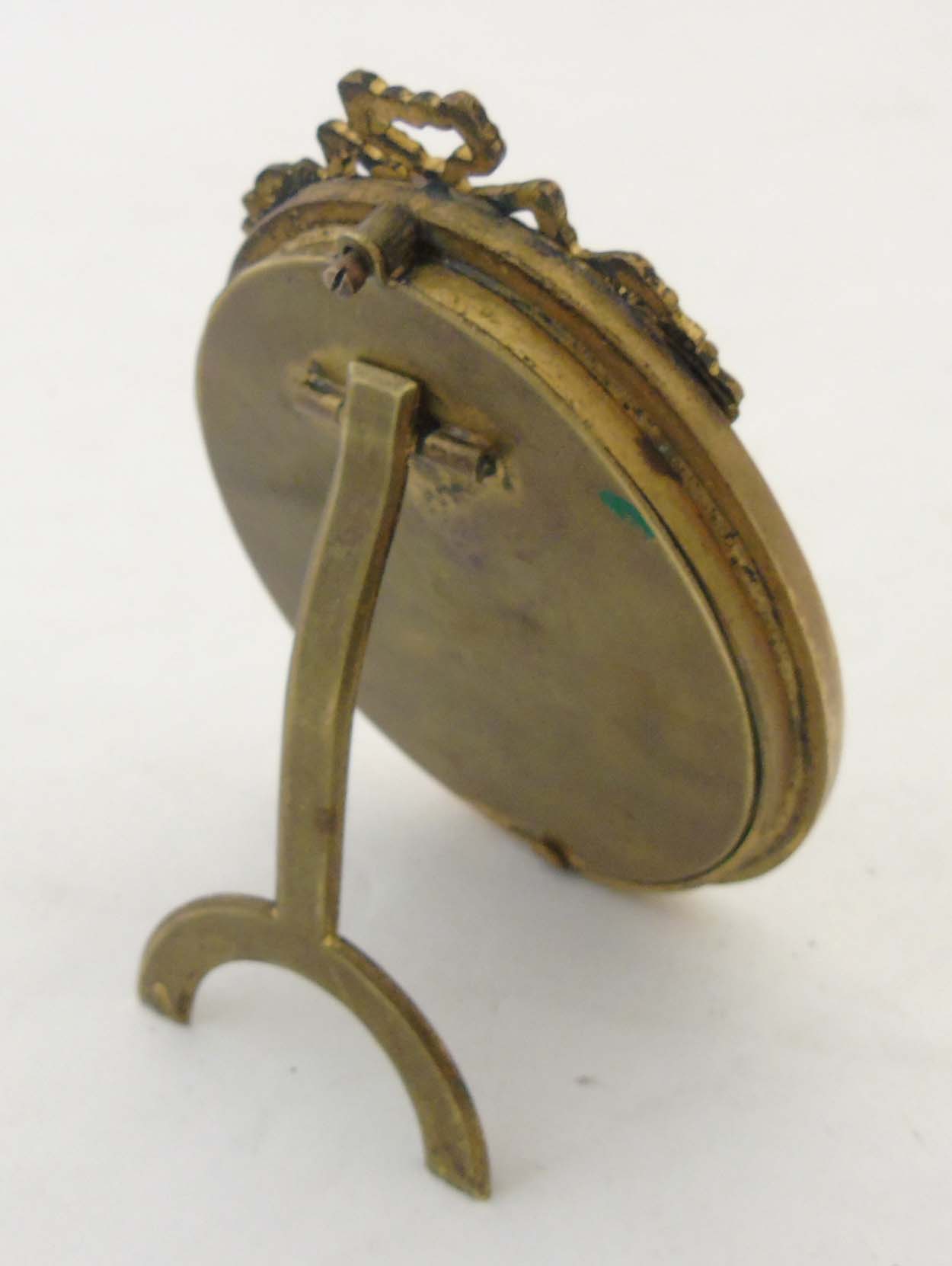 A c.1900 brass oval easel / strut frame with ribbon cresting. - Image 6 of 6