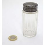 A glass dressing table jar with silver top hallmarked London c.