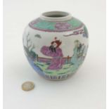 A Chinese Famille Verte ginger jar decorated in enamels of green, pink, purple and blue,
