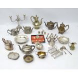 Assorted silver plated wares to include toast racks, teapots, candelabra etc.
