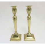 A pair of 19thC cast brass Neo Classical style candlesticks with plungers 10 5/8" high