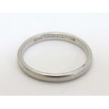 A platinum ring marked '1999 Tiffany & Co PT950' CONDITION: Please Note - we do not